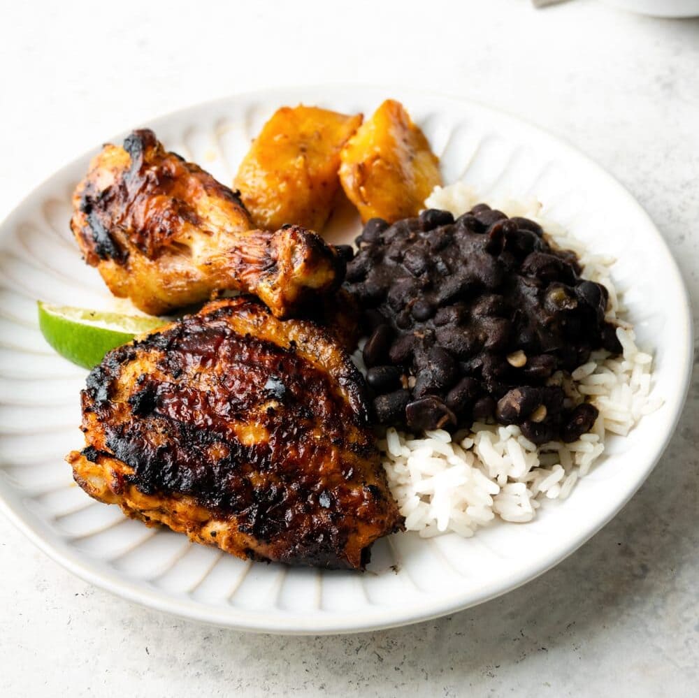 pollo asado with black beans and rice and maduros