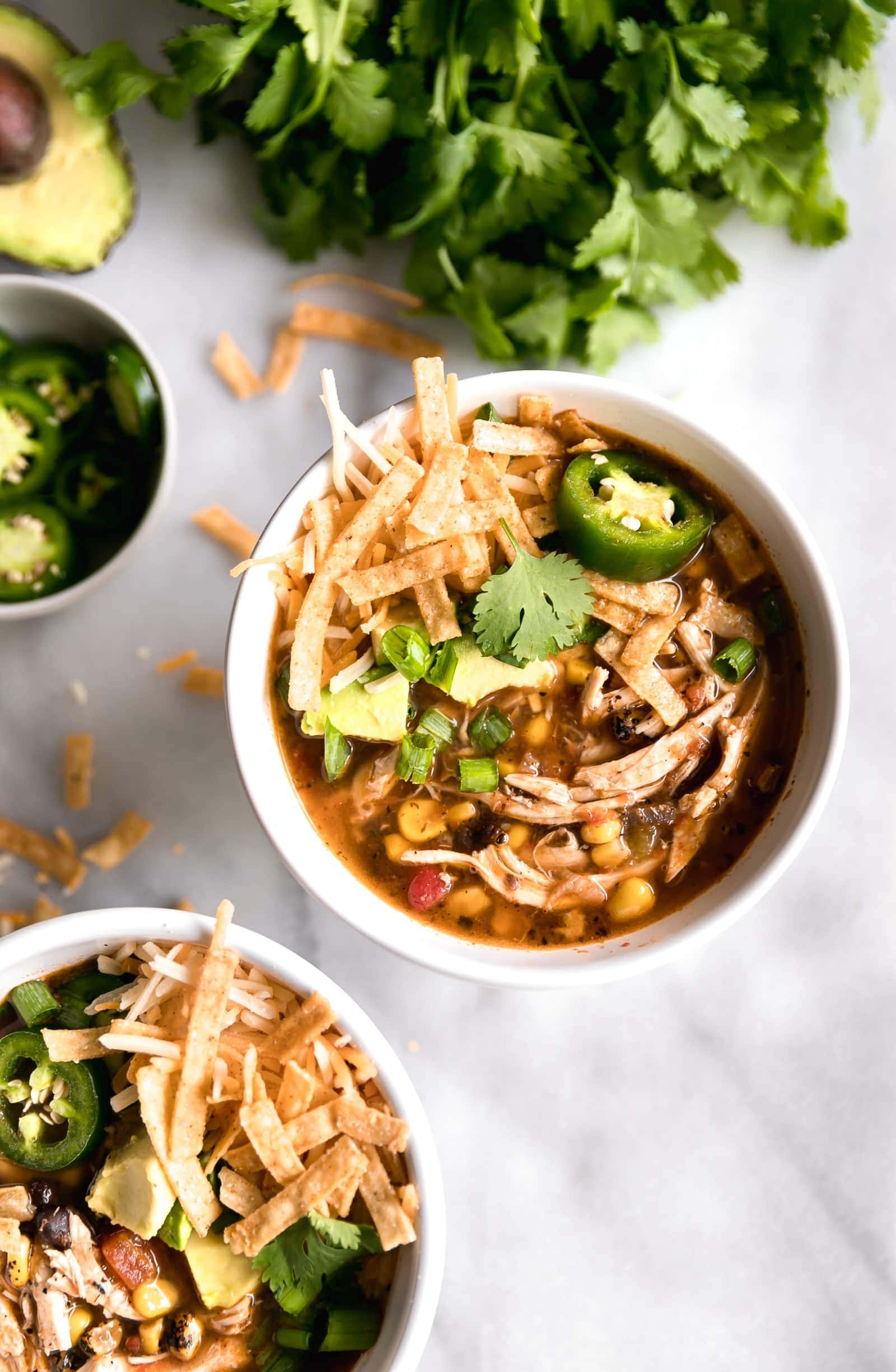 Chicken tortilla soup styled with cilantro leaves