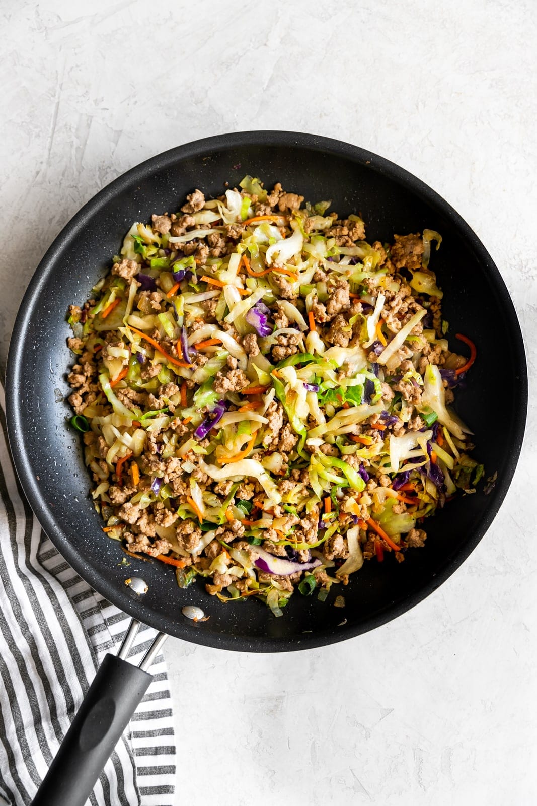 skillet with egg roll in a bowl ingredients