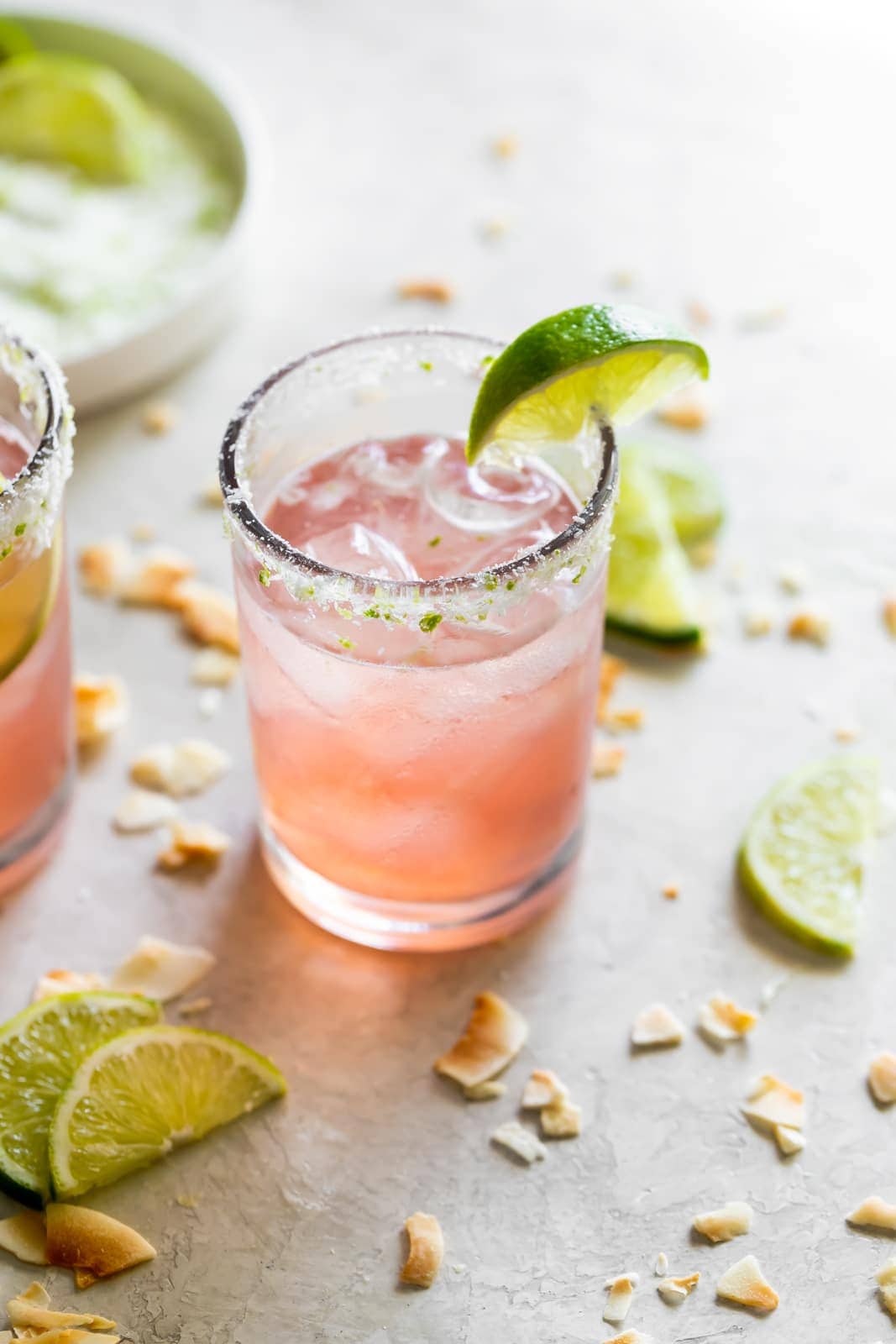 margarita made with guava nectar served over ice with a salted rim and a lime wedge