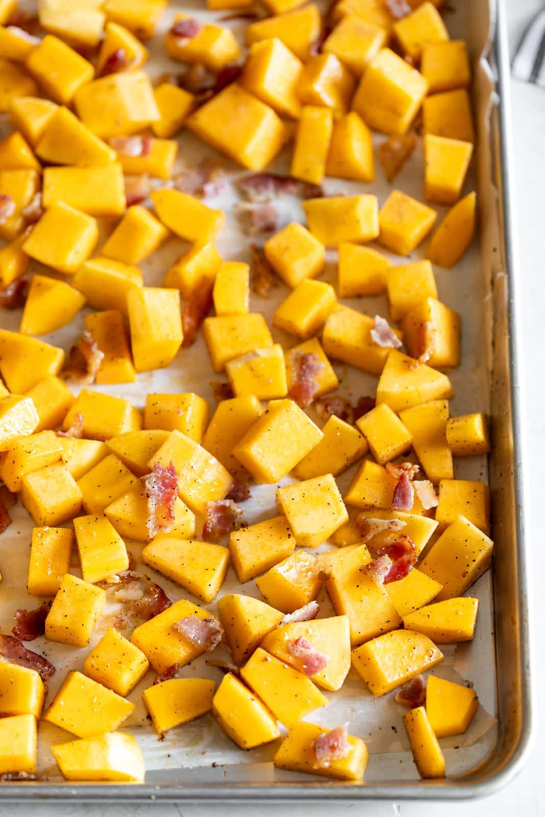 A simple savory roasted butternut squash with crisp pieces of bacon. A healthy, easy to make side dish made with just 3 ingredients!