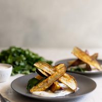Japanese sweet potato fries, sprinkled with chili powder, salt, and pepper, roasted then served with a charred scallion creme fraiche. Perfect appetizer!