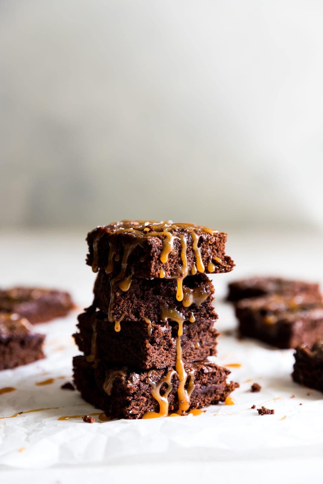 Super thick, fudgy, rich and delicious dark chocolate brownies swirled with homemade salted caramel sauce and a pinch of sea salt! 