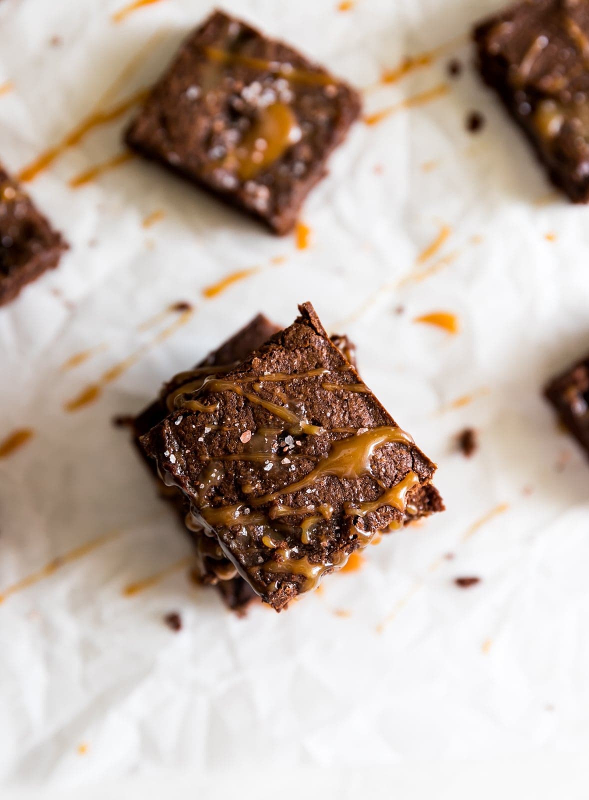 Super thick, fudgy, rich and delicious dark chocolate brownies swirled with homemade salted caramel sauce and a pinch of sea salt! 