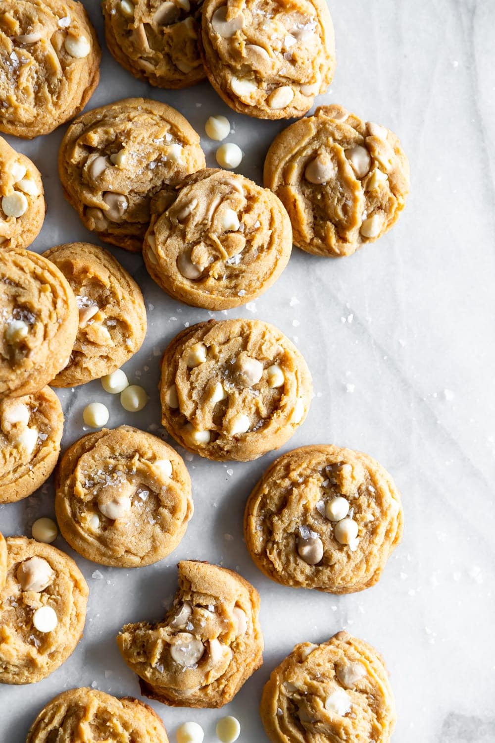 salted caramel white chocolate chip cookies on a marble slab