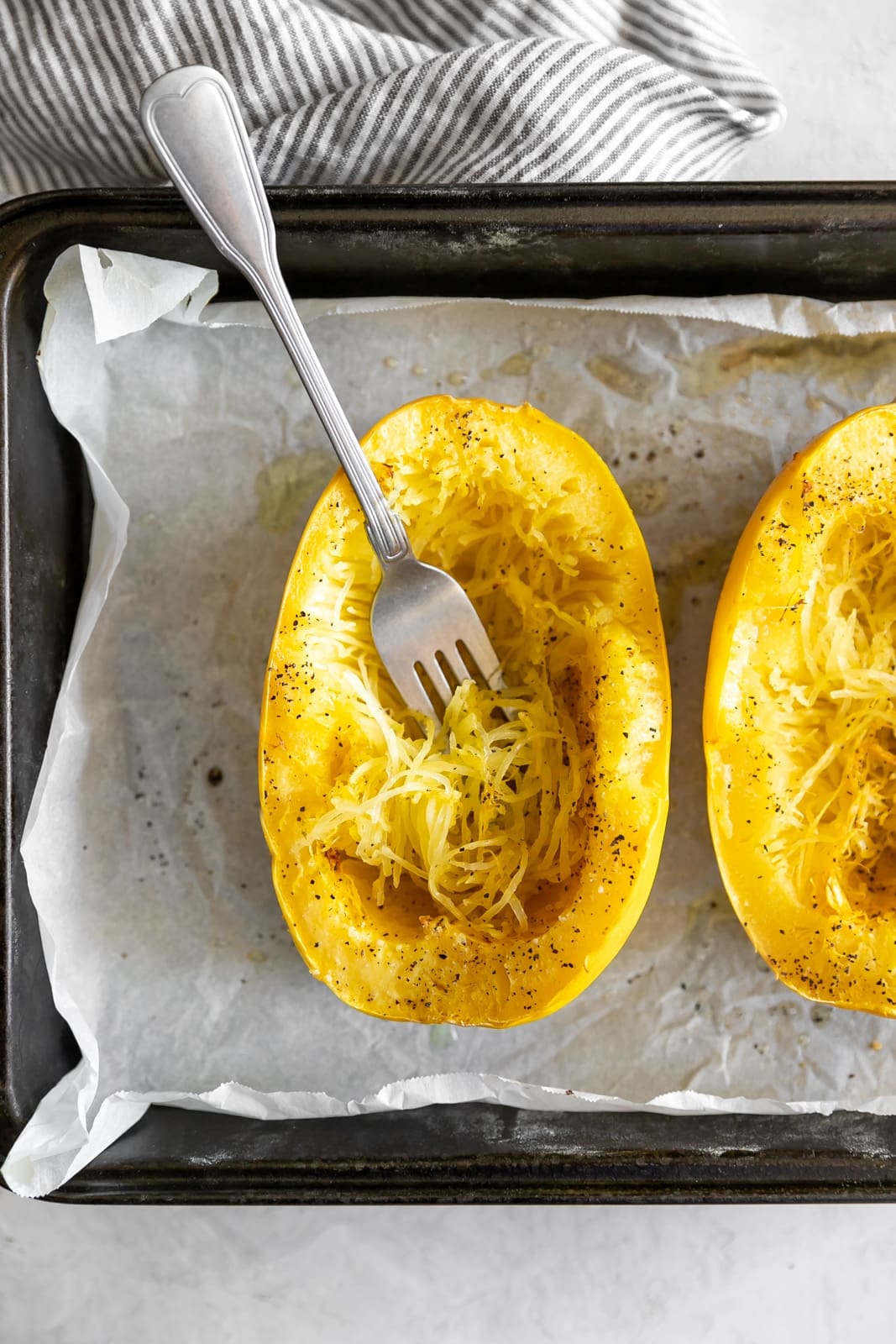 Sautéed shrimp tossed in a quick + easy garlic, red pepper flakes, parsley, white wine, and butter sauce served on top of spaghetti squash.