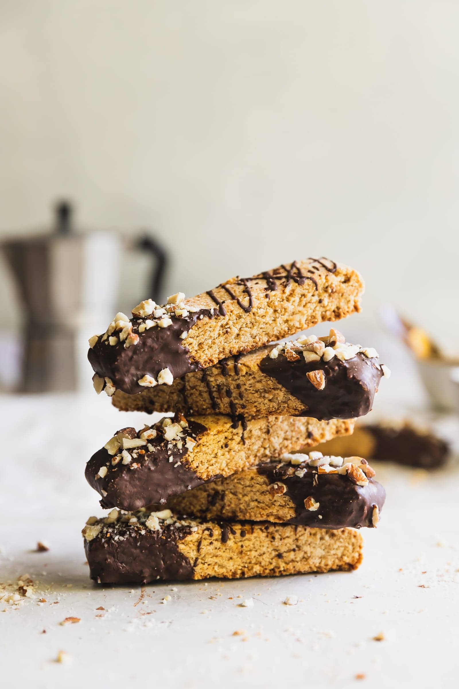 Dairy-free and grain-free almond biscotti dipped in melted dark chocolate and topped with chopped almonds. No better snack for any day of the week!