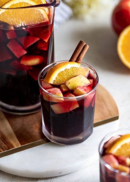 A deliciously fall-flavored red wine sangria made with pears, apples, sliced oranges and warm spices like cinnamon, ginger, and cardamom. #sangria