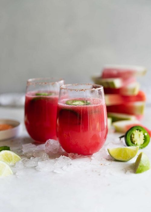 Spicy Tequila Watermelon Punch. Fresh cubed watermelon blended with tequila, lime juice, and sliced jalapeños in chili salt rimmed glasses. Refreshing drink for a hot day!