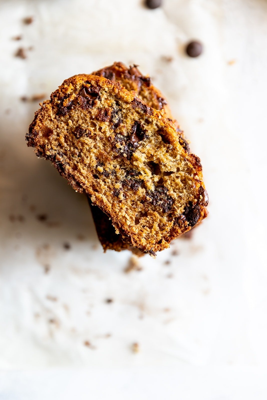 overhead view of slices of banana bread with melted chocolate chips