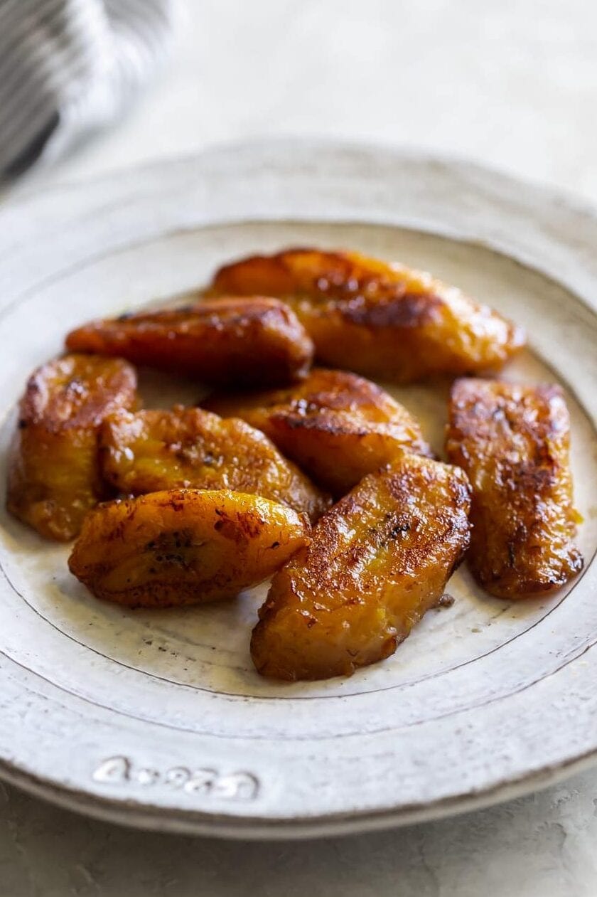 cooked sweet plantains on a white plate