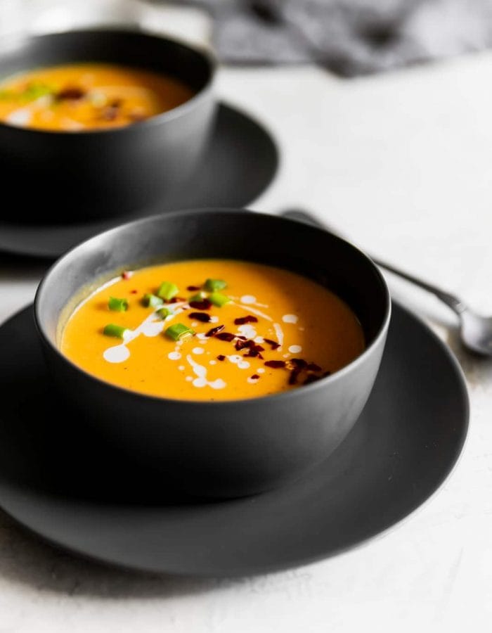 Creamy, dairy-free, and spicy vegan Thai butternut squash soup made with fresh ginger, red curry paste and coconut milk. Ready in 25 minutes!