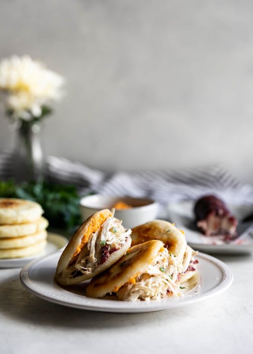 Easy-to-make arepas (pan fried corn cakes) made with homemade cranberry goat cheese and your favorite Thanksgiving leftovers!