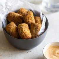 a bowl with black bean croquettes