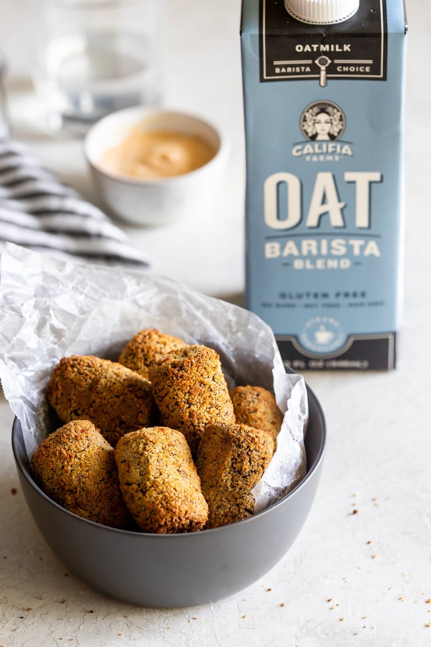 a bowl with black bean croquettes and califia farms oat milk