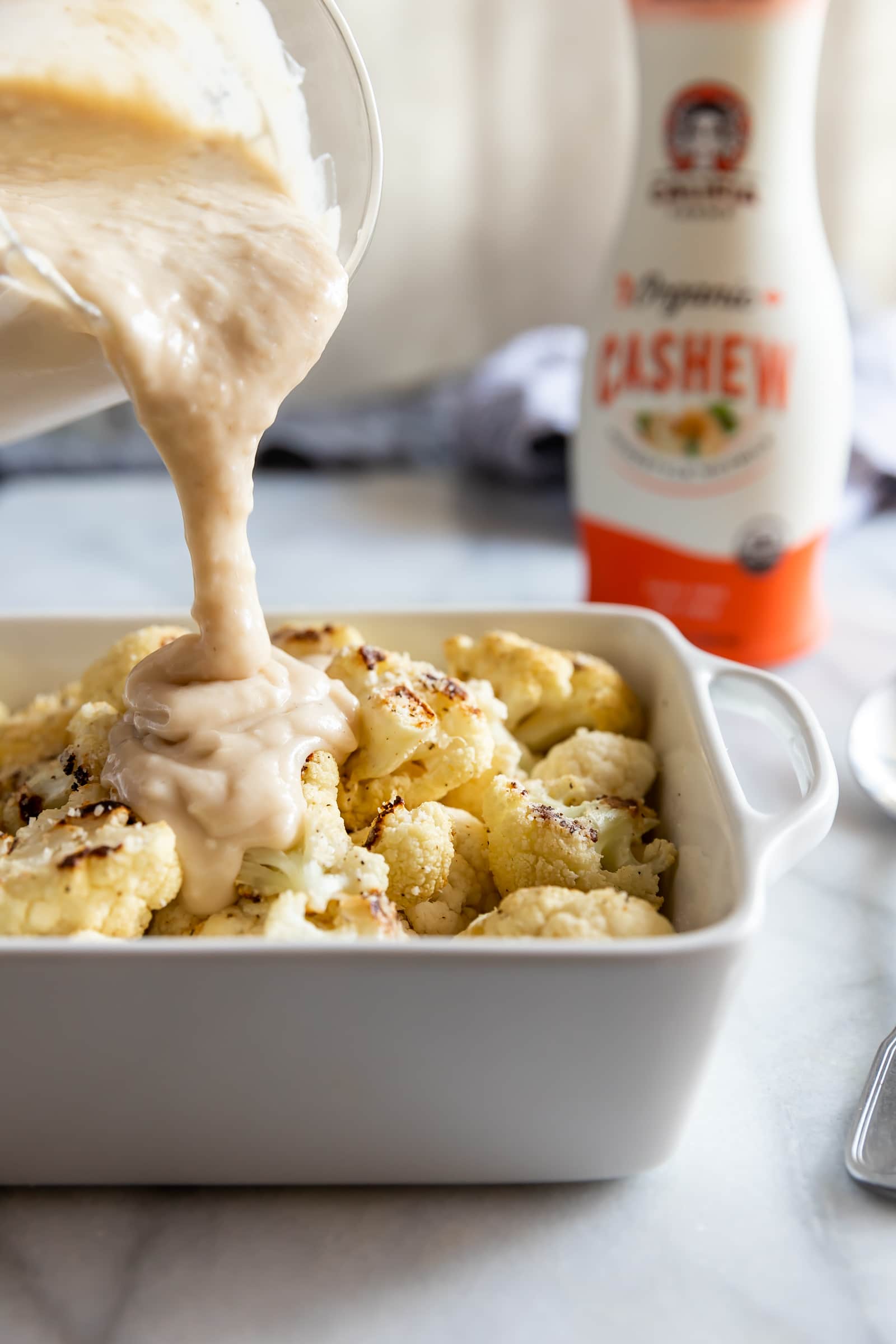 A deliciously creamy roasted cauliflower gratin made with a simple cashew cheese sauce then topped with a cheesy bread crumb topping.